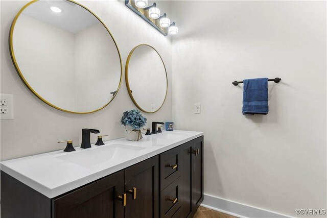 208 Minor St, Richmond, VA 23222 - full bathroom featuring double vanity and wood finished floors