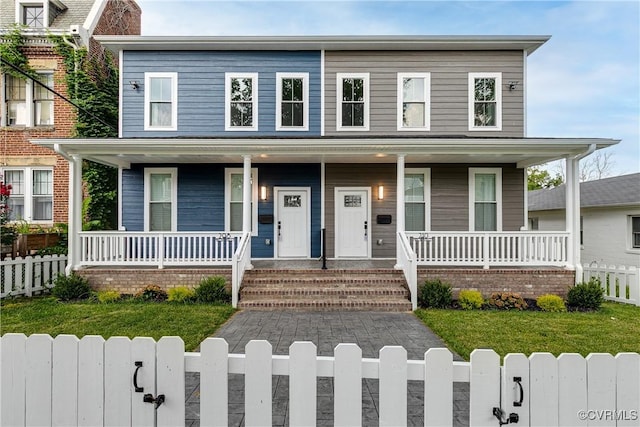 208 Minor St, Richmond, VA 23222 - view of front facade featuring a porch and a fenced front yard