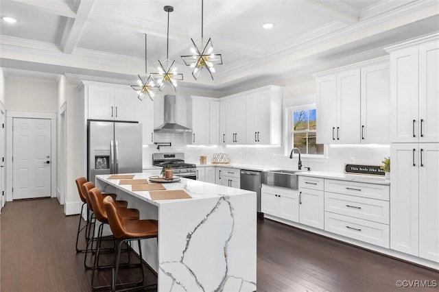 210 Minor St, Richmond, VA 23222 - kitchen featuring wall chimney exhaust hood, stainless steel appliances, a chandelier, white cabinetry, and recessed lighting