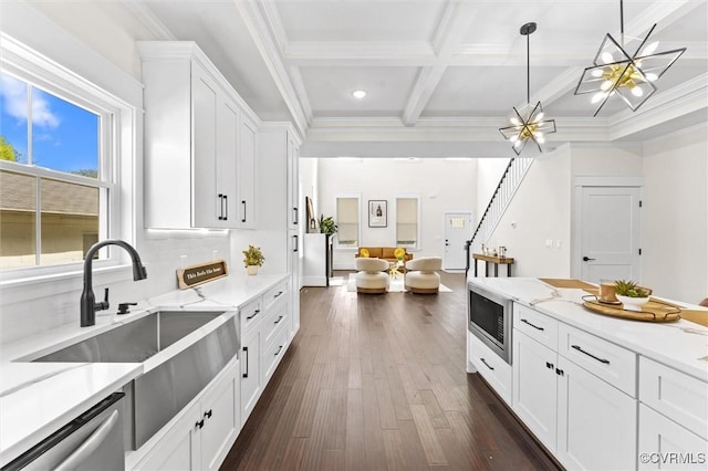 210 Minor St, Richmond, VA 23222 - kitchen with appliances with stainless steel finishes, open floor plan, dark wood-style flooring, white cabinets, and beam ceiling