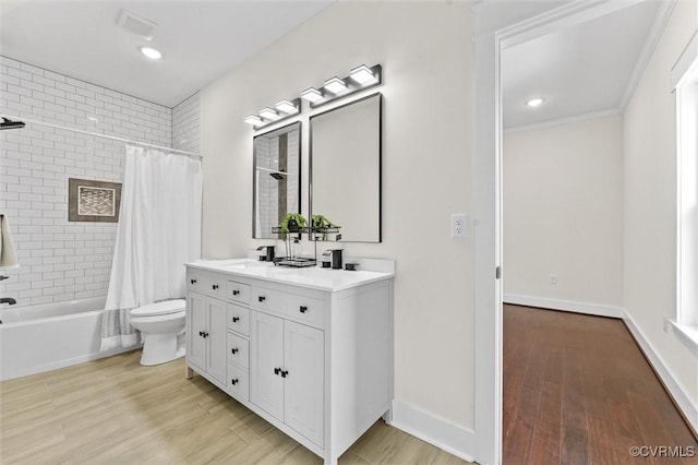 210 Minor St, Richmond, VA 23222 - bathroom featuring double vanity, shower / tub combo with curtain, wood finished floors, and recessed lighting