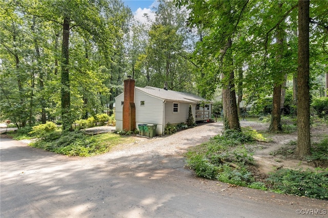 3942 Hickory Rd, Richmond, VA 23235 - view of front of house featuring a chimney and driveway