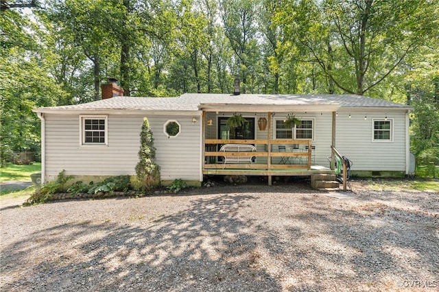 3942 Hickory Rd, Richmond, VA 23235 - view of front of property featuring a chimney, crawl space, view of scattered trees, and a porch