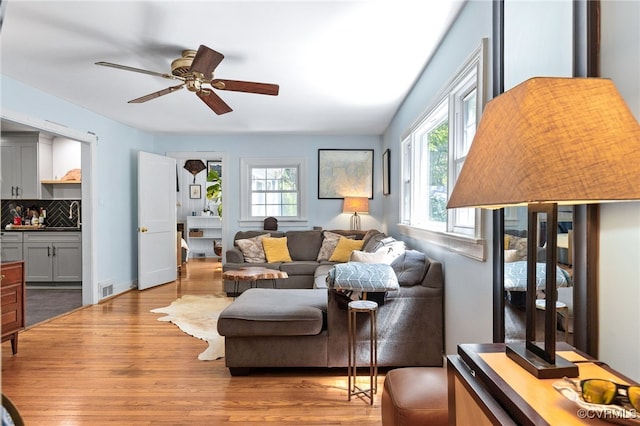 3942 Hickory Rd, Richmond, VA 23235 - living area with wood finished floors and a ceiling fan