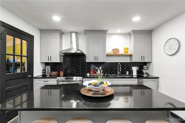3942 Hickory Rd, Richmond, VA 23235 - kitchen with wall chimney range hood, stainless steel electric stove, a kitchen breakfast bar, and backsplash