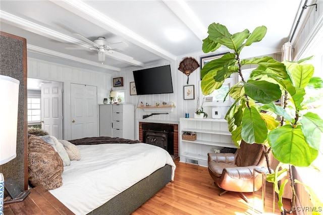 3942 Hickory Rd, Richmond, VA 23235 - bedroom with beam ceiling, wood finished floors, crown molding, a fireplace, and a ceiling fan