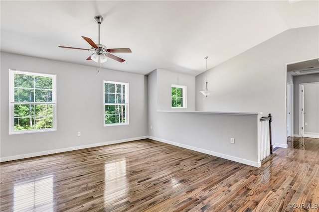 344 Land Or Dr, Ruther Glen, VA 22546 - empty room featuring plenty of natural light, lofted ceiling, wood finished floors, and a ceiling fan