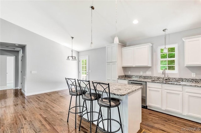 344 Land Or Dr, Ruther Glen, VA 22546 - kitchen featuring dishwasher, a kitchen breakfast bar, plenty of natural light, and white cabinets