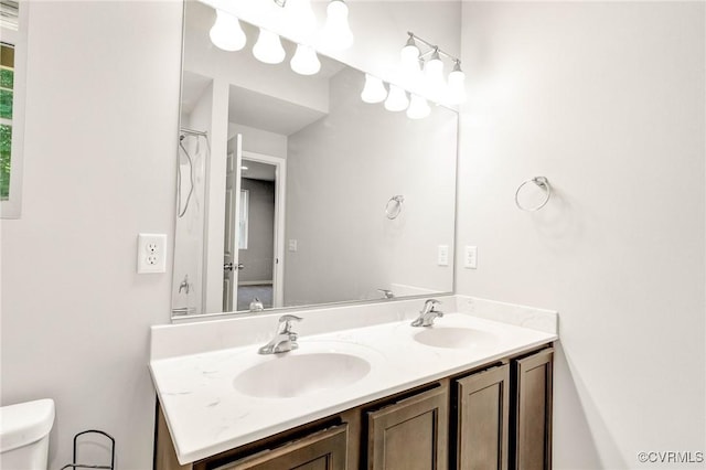 344 Land Or Dr, Ruther Glen, VA 22546 - bathroom featuring double vanity and toilet