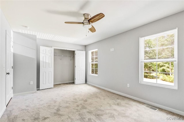 344 Land Or Dr, Ruther Glen, VA 22546 - unfurnished bedroom featuring carpet floors, a closet, and a ceiling fan