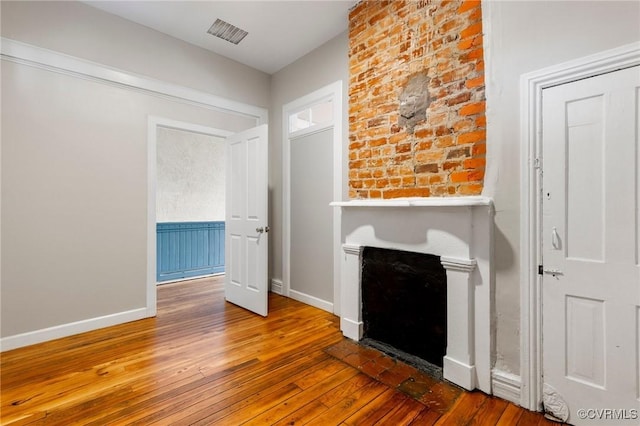 20 S Lombardy St, Richmond, VA 23220 - unfurnished living room featuring wood-type flooring and a fireplace