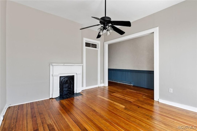 20 S Lombardy St, Richmond, VA 23220 - unfurnished living room featuring hardwood / wood-style floors, a fireplace with flush hearth, baseboard heating, and ceiling fan