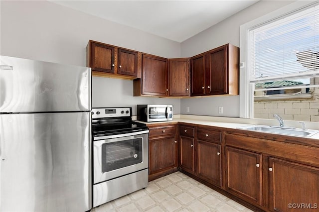 20 S Lombardy St, Richmond, VA 23220 - kitchen with stainless steel appliances, light floors, and light countertops