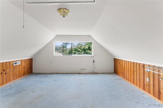 6002 Indigo Rd, Richmond, VA 23230 - additional living space with wood walls, carpet, and lofted ceiling