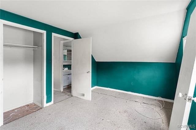 6002 Indigo Rd, Richmond, VA 23230 - unfurnished bedroom with vaulted ceiling and a closet