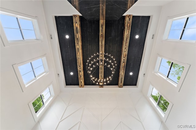 7241 Amarone Way, New Kent, VA 23124 - foyer entrance featuring a towering ceiling, a chandelier, and healthy amount of natural light