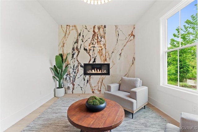 7241 Amarone Way, New Kent, VA 23124 - living area featuring a high end fireplace and wood finished floors
