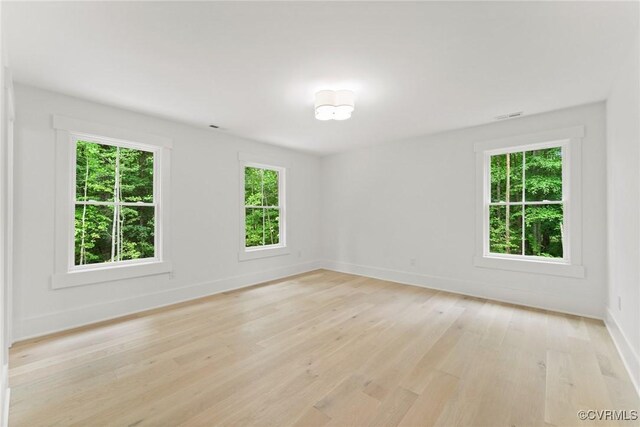 7241 Amarone Way, New Kent, VA 23124 - spare room with light wood finished floors and baseboards