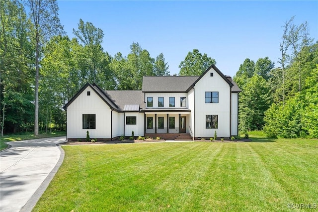 7241 Amarone Way, New Kent, VA 23124 - modern farmhouse featuring a front lawn, board and batten siding, a standing seam roof, and concrete driveway