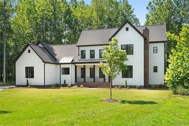 7241 Amarone Way, New Kent, VA 23124 - modern inspired farmhouse featuring a standing seam roof, board and batten siding, a front lawn, and roof with shingles