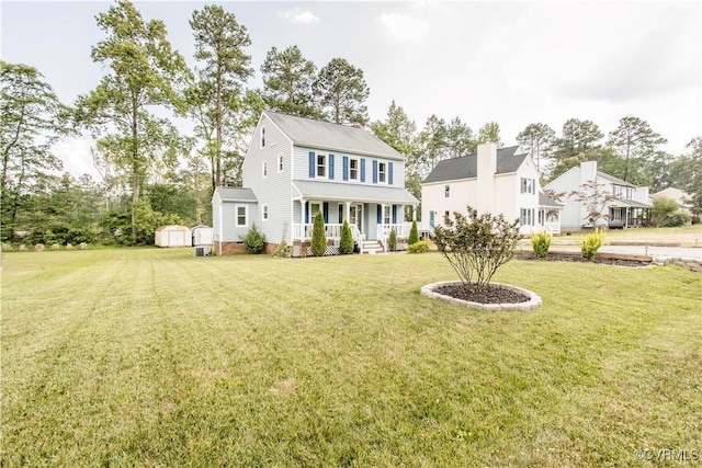 5001 Gention Rd, Chesterfield, VA 23832 - view of front of home with covered porch, a shed, and a front yard