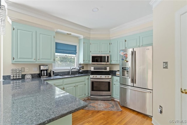 3608 Tyverton Ct, Henrico, VA 23233 - kitchen featuring stainless steel appliances, light wood finished floors, ornamental molding, and dark stone counters