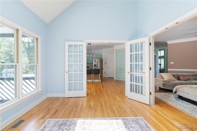 3608 Tyverton Ct, Henrico, VA 23233 - interior space featuring french doors, light wood finished floors, high vaulted ceiling, and ornamental molding