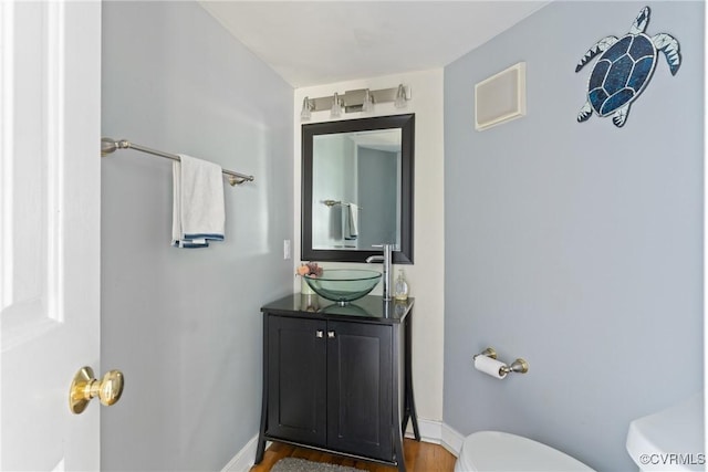 3608 Tyverton Ct, Henrico, VA 23233 - half bathroom featuring vanity and wood finished floors