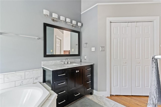 3608 Tyverton Ct, Henrico, VA 23233 - full bath with vanity, a relaxing tiled tub, and a closet