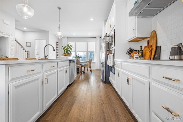 585 Rivanna Hill Rd, Glen Allen, VA 23060 - kitchen with ventilation hood, dark wood-style floors, dishwasher, backsplash, and light countertops