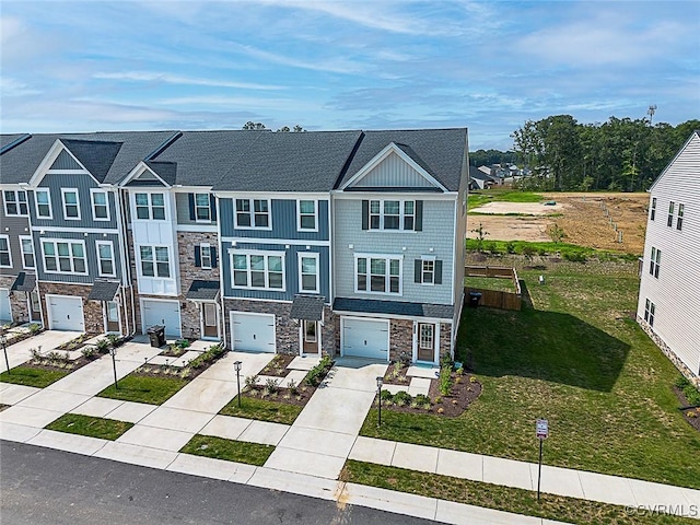 585 Rivanna Hill Rd, Glen Allen, VA 23060 - townhome / multi-family property featuring stone siding, driveway, an attached garage, a front yard, and a residential view
