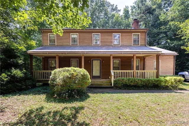 7710 Buttermere Ct, Chesterfield, VA 23832 - view of front of house with covered porch, a chimney, and a front lawn