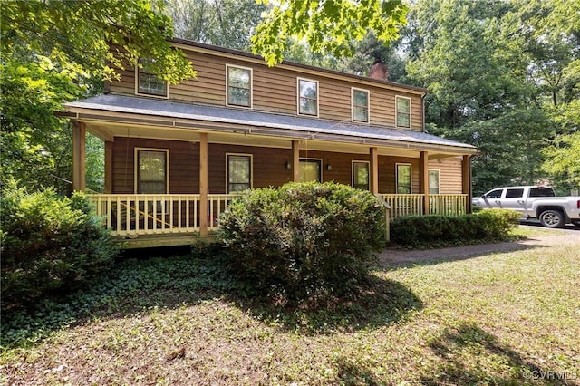 7710 Buttermere Ct, Chesterfield, VA 23832 - view of front facade featuring a porch, a chimney, and a front lawn