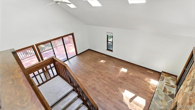 636 Spirea Rd, North Chesterfield, VA 23236 - unfurnished living room with ceiling fan, wood finished floors, high vaulted ceiling, and a skylight