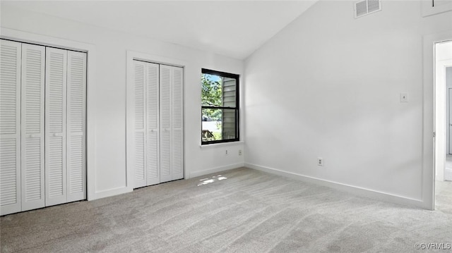 636 Spirea Rd, North Chesterfield, VA 23236 - unfurnished bedroom with carpet flooring, lofted ceiling, and multiple closets