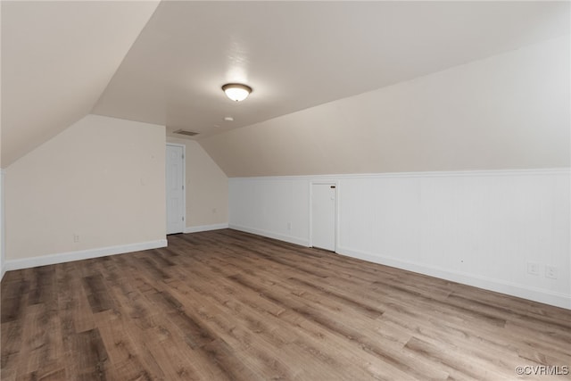 102 Penrith Ct, Williamsburg, VA 23185 - additional living space featuring wood finished floors and vaulted ceiling