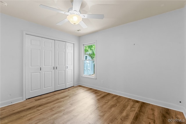 102 Penrith Ct, Williamsburg, VA 23185 - unfurnished bedroom featuring light wood-type flooring, a closet, and ceiling fan