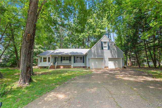 102 Penrith Ct, Williamsburg, VA 23185 - view of front facade with covered porch, crawl space, driveway, a front yard, and an attached garage