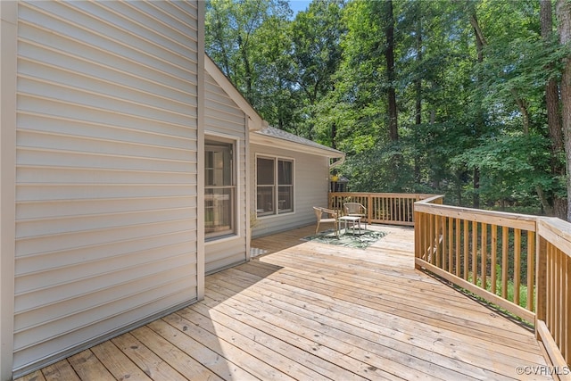102 Penrith Ct, Williamsburg, VA 23185 - deck featuring outdoor dining space and view of wooded area