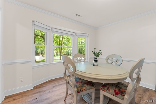102 Penrith Ct, Williamsburg, VA 23185 - dining area with light wood finished floors and crown molding