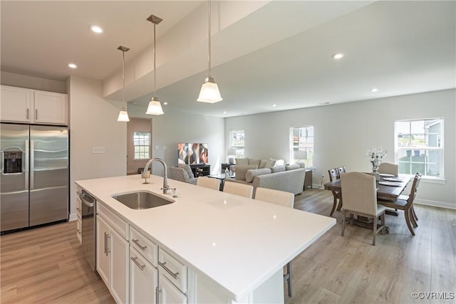14106 Botsford Ave, Chesterfield, VA 23831 - kitchen featuring appliances with stainless steel finishes, white cabinetry, light wood-type flooring, plenty of natural light, and recessed lighting