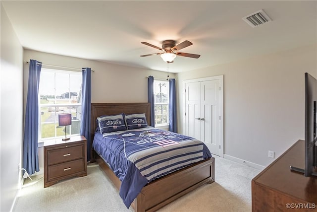 14106 Botsford Ave, Chesterfield, VA 23831 - bedroom featuring light carpet, a closet, and a ceiling fan