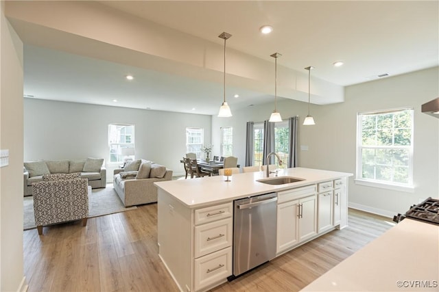 14106 Botsford Ave, Chesterfield, VA 23831 - kitchen with stainless steel dishwasher, white cabinetry, light wood-style flooring, light countertops, and decorative light fixtures