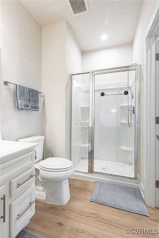 14106 Botsford Ave, Chesterfield, VA 23831 - bathroom with vanity, a shower stall, and wood finished floors