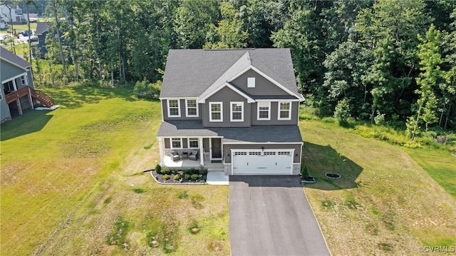 14106 Botsford Ave, Chesterfield, VA 23831 - view of front of property featuring asphalt driveway, a garage, a front yard, and stone siding