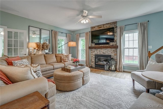 3731 Rivermist Ter, Midlothian, VA 23113 - living area featuring ceiling fan, a stone fireplace, and wood finished floors