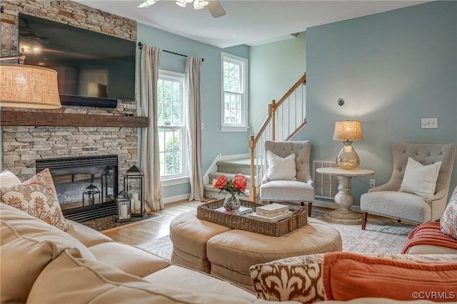 3731 Rivermist Ter, Midlothian, VA 23113 - living room with stairs, plenty of natural light, wood finished floors, and a stone fireplace