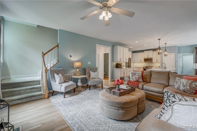 3731 Rivermist Ter, Midlothian, VA 23113 - living area featuring stairs, light wood-style flooring, a ceiling fan, and recessed lighting