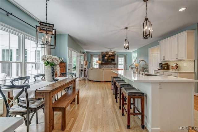 3731 Rivermist Ter, Midlothian, VA 23113 - kitchen featuring a chandelier, plenty of natural light, light wood finished floors, light countertops, and recessed lighting