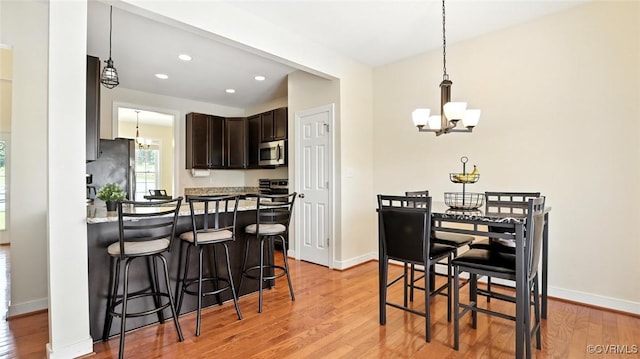 3809 Crows Nest Ct, Hopewell, VA 23860 - dining area featuring a chandelier, light wood finished floors, and recessed lighting